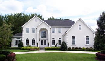 high value homeowners insurance in westchester new york - Large white house with manicured lawns