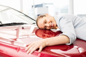 Auto Insurance - Woman hugging her car