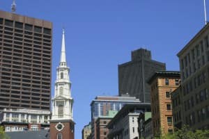 A church among city buildings - church property and building insurance